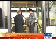 Peshawar Development Authority Media Coordinator Umar Afridi shows the new hybrid Peshawar BRT Bus on Samaa TV